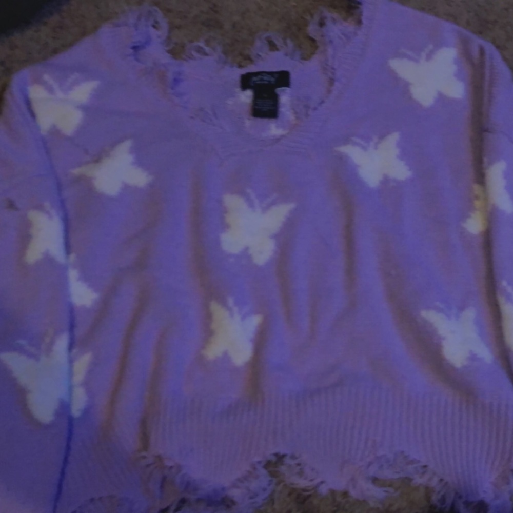 A “Just Polly” fringe top